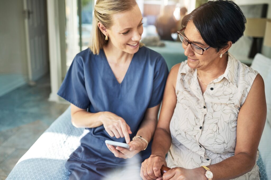Happy woman, nurse and phone in elderly care for support, consultation or healthcare diagnosis at h